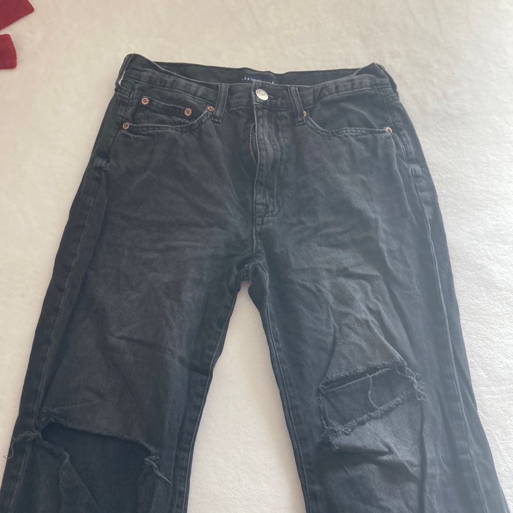 Black knee ripped jeans